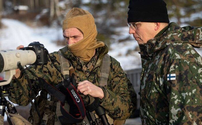 Finnish Soldiers Skiing Through Snowy Forest